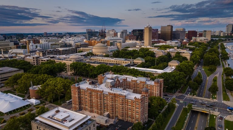 Low-altitude aerial view of MIT campus buildings and roads